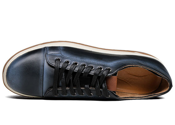 Mujeres de pie redondo de cuero zapatillas de deporte de moda zapatillas de patineta para hombres