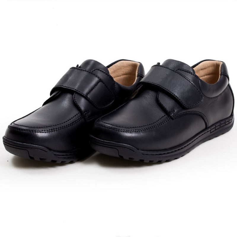 Zapatos escolares unisex de cuero negro tamaño 26-45 Talón plano con forro de cuero